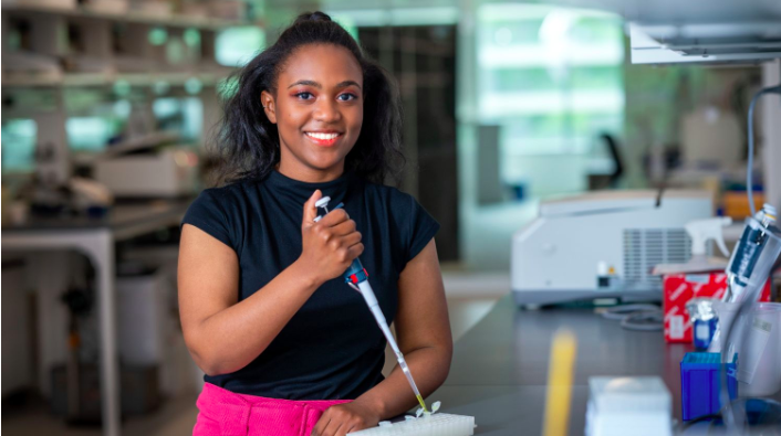 Imani Madison holds a pipette